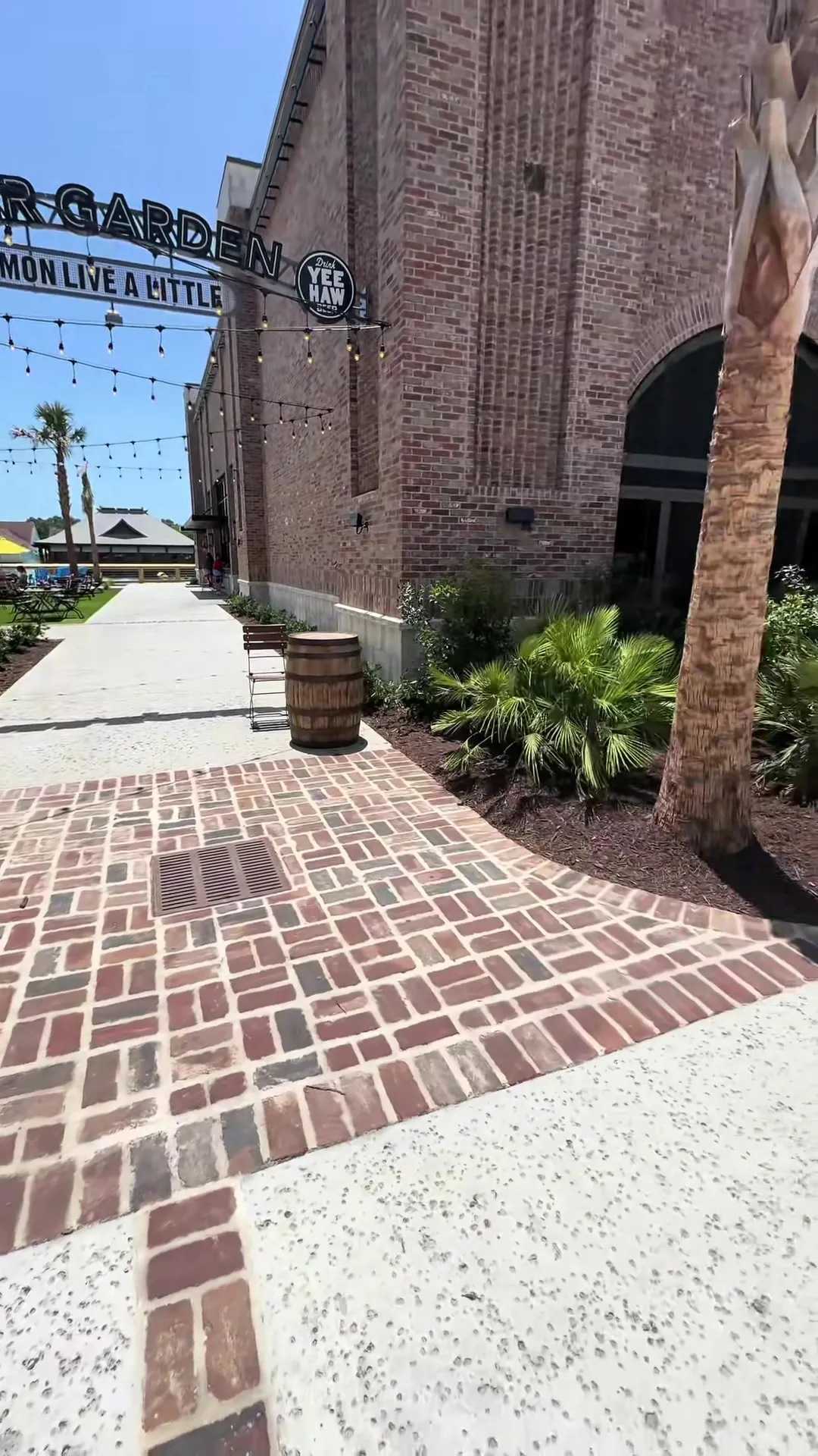 Stamped and scored commercial plaza with brick banding