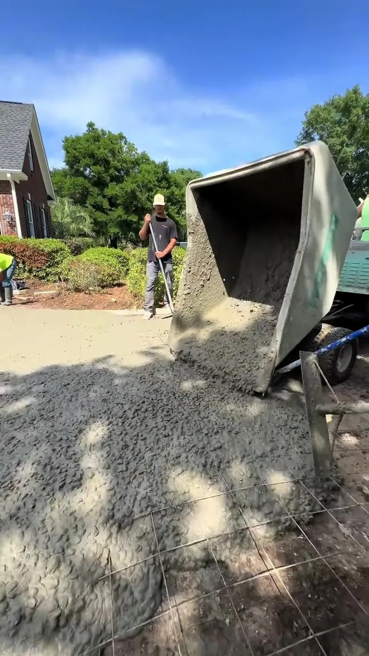 Premier Concrete crew pouring a slab from the branded power buggy