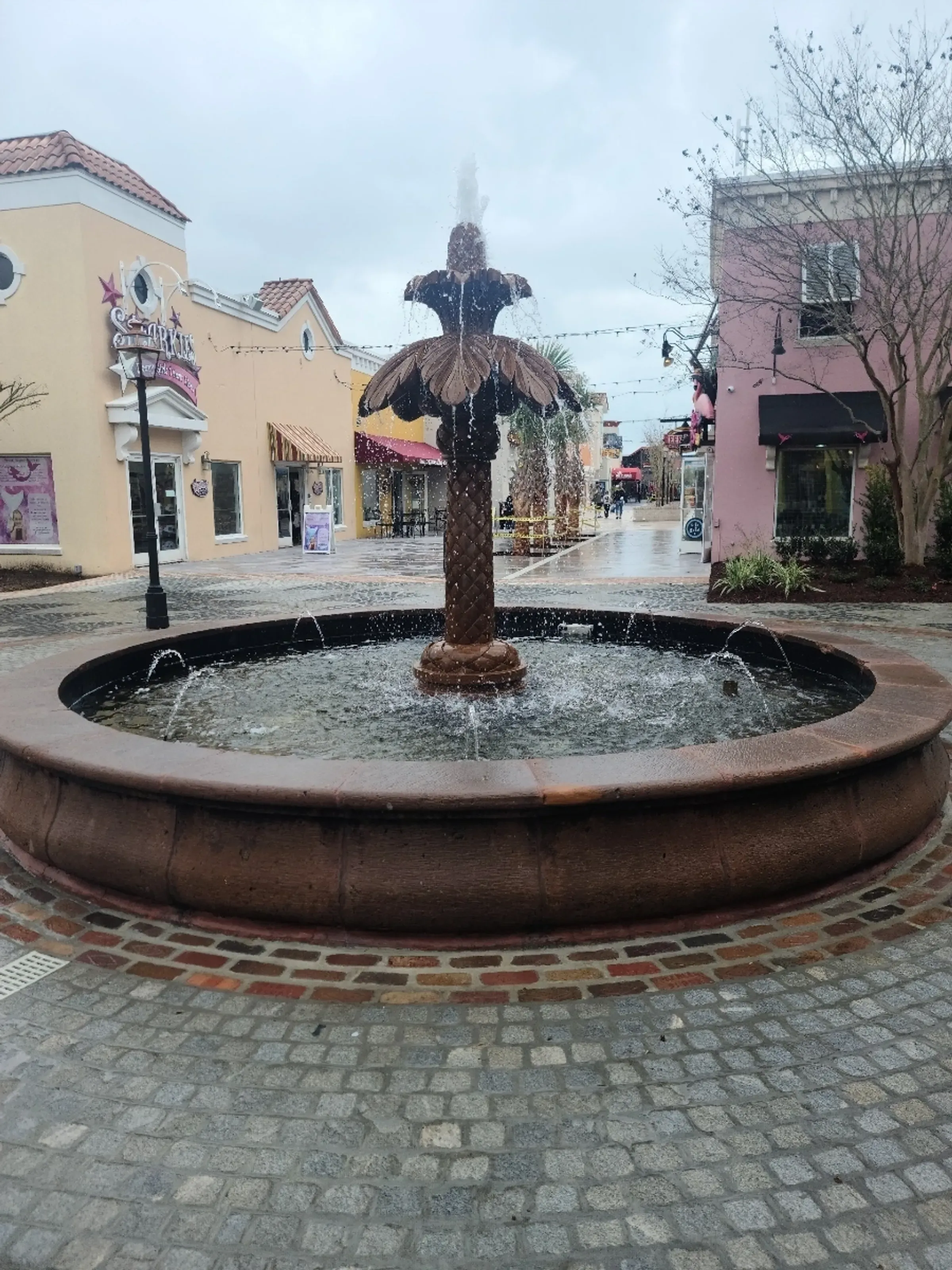 Brick plaza with a central fountain downtown